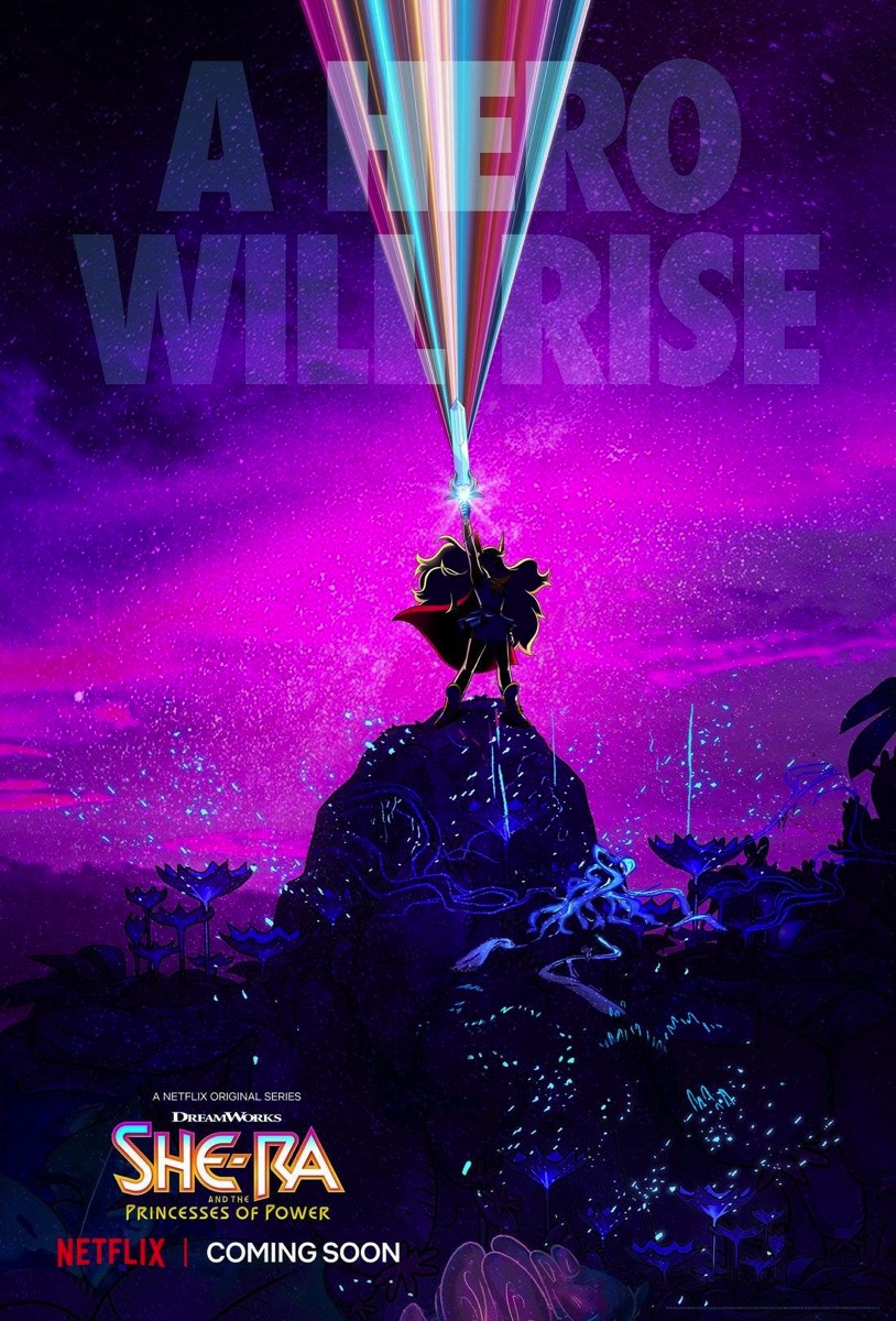 She-Ra in silhouette with glowing blonde hair and red cape stands on a rock. She holds her sword aloft, and its jewel sparkles. -- A hero will rise. She-Ra and the Princesses of Power